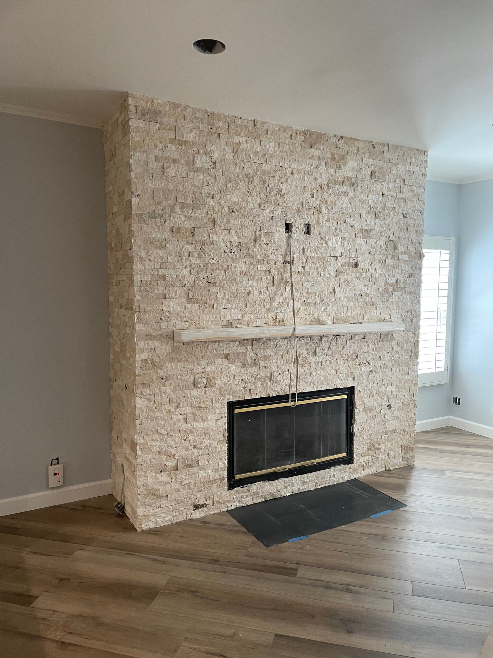 Chimney with stone veneer finish